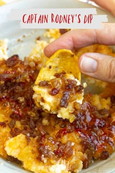 a person is dipping some food into a bowl with the words captain robiny's dip on it