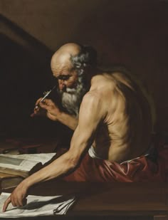 an old man sitting at a desk writing and holding a pen in his right hand