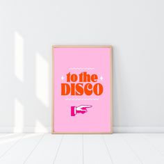 a pink poster with the words to the disco on it in front of a white wall