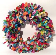 a colorful wreath made out of small pieces of paper