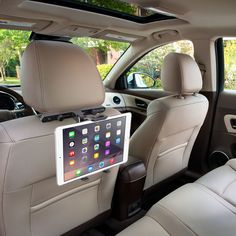 the back seat of a car with an ipad attached to it