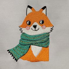 an embroidered fox with a scarf around its neck