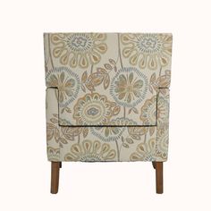 an upholstered chair with wooden legs and floral pattern on the armrests