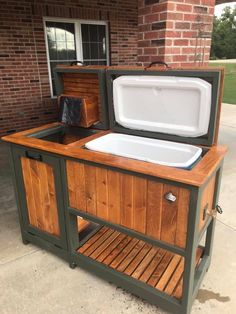 an outdoor cooler is built into the side of a house