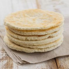 a stack of flat bread on top of a piece of paper