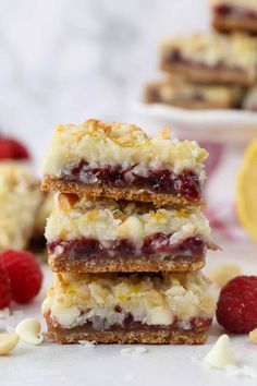 raspberry lemon bars stacked on top of each other