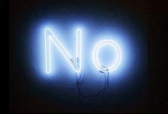 a neon sign that says no in the middle of it's frame, with wires plugged into it