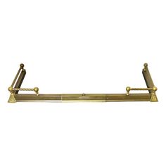 an antique brass plated metal shelf with two handles and three bars on each side