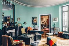 a living room filled with furniture and a fire place