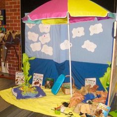 a tent that has been set up outside for children to play under the sun and clouds