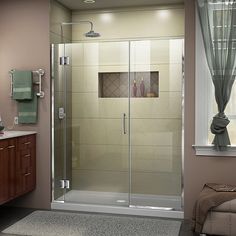 a bathroom with a walk in shower next to a sink