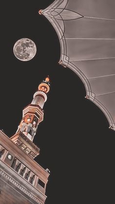 the moon is shining over a building with a clock tower