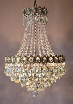 a crystal chandelier hanging from the ceiling