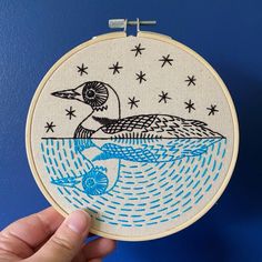 Hook Line Tinker complete embroidery kit includes hoop thread floss stitch guide blue and black loon on water mirrored reflected Loon Embroidery, Modern Embroidery Kit, Hand Embroidery Kits, Hand Embroidery Kit, Bird Crafts, Easy Stitch, Beautiful Bird, Trumpeter, Hand Embroidery Pattern