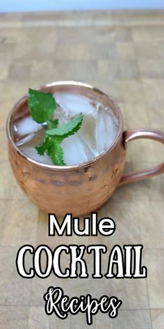 a copper mug filled with ice and mint on top of a wooden table next to the words mule cocktail recipes