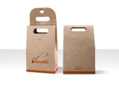 two brown paper bags sitting next to each other