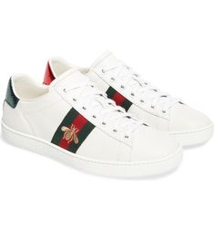 Free shipping and returns on Gucci New Ace Sneaker (Women) at Nordstrom.com. Golden bee embroidery and striped webbing bring iconic Gucci house codes to this sneaker, while contrasting heel tabs reference the brand's official colors. Tenis Gucci, Sepatu Platform, Gucci Sneaker, Designer Sneakers Women, Best White Sneakers, Gucci Ace Sneakers, Gucci Shoes Sneakers, Sneaker Outfits Women, Gucci Sneakers