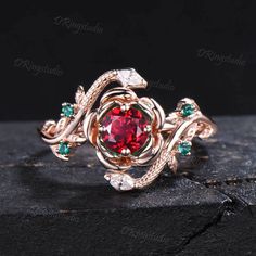 With its velvet red fire and its inspirational powers, Ruby rings very much encourage you to light up your inner light, which represents more love, confidence, power, and pleasure. Ruby rings have long been known for their rich connections to creativity and love. INSPIRATION GIFTS CHOICE : Dainty Ruby Ring comes in a delicate jewelry box, it is a good choice of an anniversary, engagement, birthday, Mother's day gifts, Christmas day, thanksgiving day, valentines day gift for couple, friend, family . It is also a gift for someone who believes in the healing powers of gems. ● RING DETAIL : Main stone : 5mm Round lab created Ruby Side stone : Emerald and Moissanite This ring can be customized by other gems stones, please contact us directly if you need :) ● Warranty 100 days warranty policy. I Dainty Ruby Ring, Serpent Ring, Ruby Rings, Emerald Diamond Ring, Inner Light, Rose Engagement Ring, Proposal Gifts, Gold Snake, July Birthstone