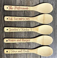 four wooden spoons with the names of three different people and their names on them