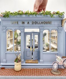 there is a doll house that looks like a store