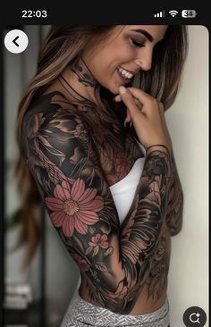 a woman with tattoos on her arms and chest