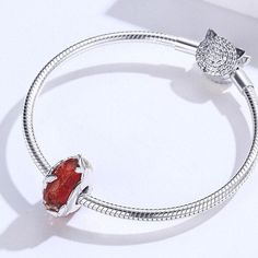 This is charm only bracelet is sold separately. Elegant red color diamond cut texture Murano glass bead charm for Pandora style bracelet, features tiny butterflies decoration, made of solid 925 sterling silver with platinum plating and high quality glass crystal. Upgrade your bracelet game with this stunning Red Murano butterfly glass bead charm! Its dazzling diamond cut texture, elegant red color, and intricate tiny butterfly decorations make it a must-have for any Pandora style bracelet. Craft Elegant Butterfly Charm For Gift, Elegant Jewelry With Butterfly Charm And Round Beads, Elegant Sterling Silver Butterfly Charm, Elegant Red Charm Bracelet With Heart Charm, Elegant Silver Gemstone Charm Bracelet, Red Faceted Jewelry For Gifts, Cubic Zirconia Charm Bracelet Gift, Cubic Zirconia Jewelry With Removable Charms For Gift, Red Crystal Bracelet Perfect For Gifts