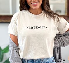 Comfort Colors® In My Mom Era Shirt, Retro Mom Era Shirt, Comfort Colors Mom Shirt, Eras Shirt, Mom Shirt, Retro Mom Shirt, Gift for Mom In My Mom Era, Comfort Color Mom Shirt, Mama Shirt, Mom Era, Mom Life, Cute Mom Shirt, Gift For Mom ❤ Comfort Colors Brand ❤ Unisex Adult Sizing ❤ 100% Cotton ❤ DTG (Direct To Garment) printing, which means the ink is directly printed into the fabric Additionally, since all items are custom made to order, we do not accept returns or exchanges. Please carefully review the sizing details provided, as our t-shirts are unisex and not specifically tailored for women. For a slimmer fit, ladies should consider ordering one size down. Many designs in our shop can be customized, but additional costs may apply depending on the specific custom request. To place an o In My Mom Era, Mom Era, Mama Shirts, Comfort Color, Mama Shirt, Mom Shirt, Direct To Garment Printer, Family Shirts, Mom Shirts