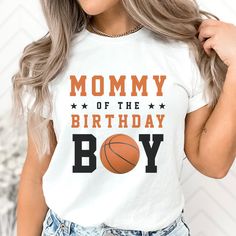 a woman wearing a t - shirt that says mommy of the birthday boy with a basketball on it