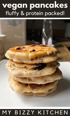 a stack of pancakes on a plate with the words vegan pancakes fluffy & protein packed