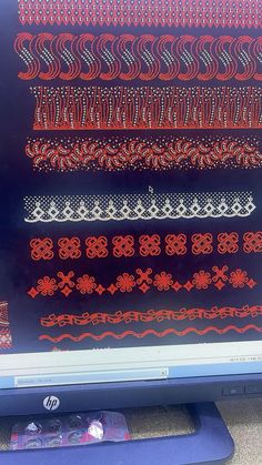 a computer screen with many different designs on it's display area, including red and white laces