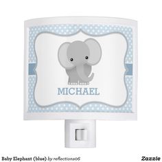 a night light with an elephant on the front and pink polka dot border around it