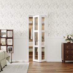 a bedroom with white walls and wooden floors