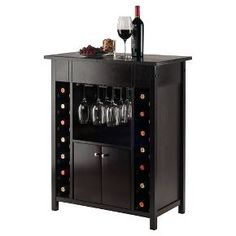 a wine rack with bottles and glasses on it