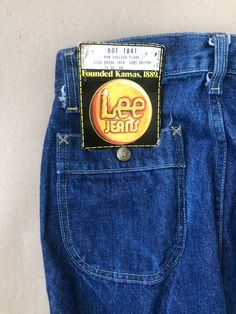 Unworn, originating from the archive of a jeans shop that closed down late last century.  Vintage Lee  New Chelsea flare in one wash heavy denim from the 70s.  100% cotton made in Belgium.  Pockets in the front and back, back ones closes with snap buttons High rise fit with prominent flared legs Waist: 72cm / 28'' Front rise: 30cm / 12'' Seat: 94cm / 37'' Inseam: 88cm / 34.5'' Label size W29 L34, equivalent within the range of a modern S Advice to find your fit is found below! Look at the measur Jeans Name, Flared Denim, Union Made, Lee Jeans, Womens Jeans, Denim Flares, Small Waist, Vintage Jeans, High Waisted Pants