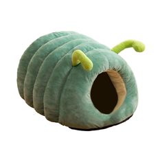 a green caterpillar shaped cat bed with four holes on the front and bottom