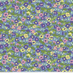 a blue and green floral pattern with pink, yellow, and purple flowers on it