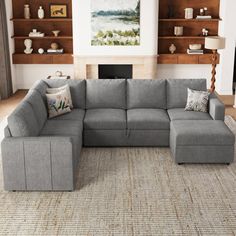 a living room with a large gray sectional couch