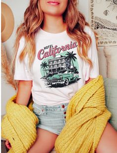 California shirt, palm trees, ocean shirt, beach shirt, summer clothing, sunshine shirt, vacation shirt, retro shirt, trendy summer shirt, My shirts, sweatshirts, and tanks are a fun and joyous way to show your style while shopping, heading to the beach, and bringing your children to social events, family outings, and everyday life. All my t-shirt designs are direct to garment and provide the best quality and longevity.  Hotel California Picture: Beach, Car, Palm Trees, Hotel Sizes: S - 2XL  Fab Retro Printed Summer T-shirt, Summer Cotton T-shirt With Palm Tree Print, Vintage Printed T-shirt For Vacation, Summer Cotton Hawaiian Shirt With Letter Print, Summer Hawaiian Cotton Shirt With Letter Print, Relaxed Fit Cotton T-shirt With Palm Tree Print, Cotton T-shirt With Palm Tree Print In Relaxed Fit, Relaxed Cotton Top With Palm Tree Print, Summer Casual Hawaiian Shirt With Crew Neck