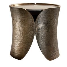 two metal vases sitting on top of each other