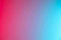 a red, blue and pink background with an orange light