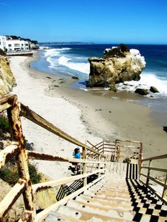 stairs lead down to the beach and ocean