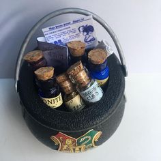 there are some bottles in the basket with corks on it's sides and tags attached to them