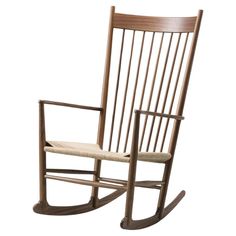 a wooden rocking chair with a cushion on it