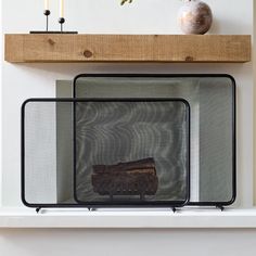 two pieces of glass sitting on top of a shelf