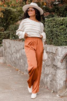 Details Rust Smocked Waist Pants Fabric only has stretch in waistbandåÊ Smocked waistband, pocketsåÊ Pair these pants with a sweater and booties! UnlinedåÊ Size small from shoulder to hem: 42" Material and Care 100% polyesteråÊ Hand wash cold, hang to dryåÊ Patterns may vary Materials may have natural variations Colors may vary from different viewing devices. Orange Silk Pants Outfit, Copper Pants Outfit Burnt Orange, Burnt Orange Pants Outfit Work, Orange Sweatpants Outfit, Orange Pants Outfit Work, Burnt Orange Pants Outfit, Rust Pants Outfit, Peach Pants Outfit, Pantalon Naranja Outfits