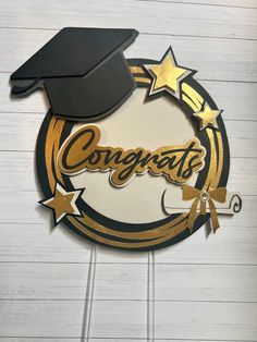 congratulations sign with graduation cap and star on it