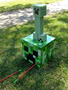 a homemade minecraft creeper made out of paper machs