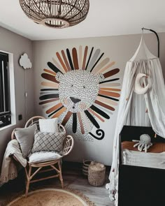 a baby's room decorated in neutral tones with a lion wall decal on the wall