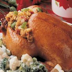 a turkey with stuffing and broccoli on a plate