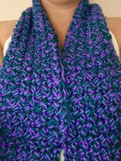 a woman wearing a purple and blue scarf with the words pdde pattern on it